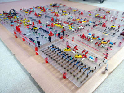 Educational electronics circuit boards with coloured components on perspex panels