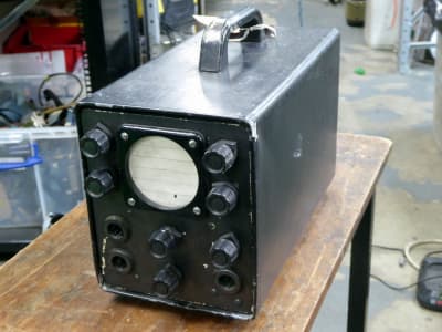 Graphite coloured period oscilloscope with round tube & black knobs