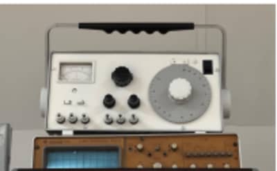 White laboratory instrument with large tuning dial