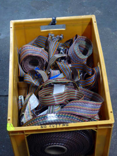 Crate of assorted rainbow coloured ribbon cable