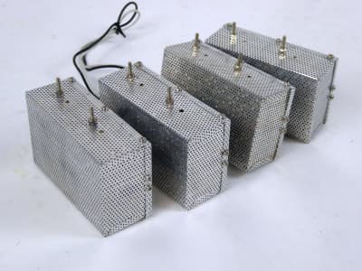 4x small perforated aluminium boxes with linking wires