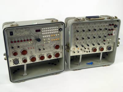 Twin military control panels with switches, buttons in clam shell rugged case