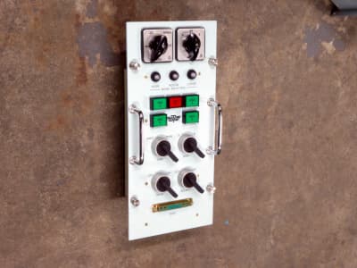 Non-practical navy panel with square coloured buttons & rotary switches