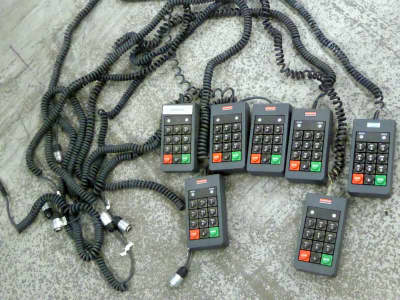 Chunky black keypads with particularly long curly cable