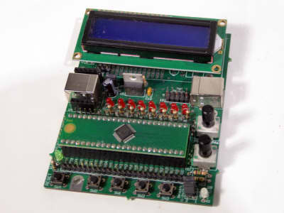 Part practical microchip development Printed Circuit Board with LEDs, buttons blue LCD display