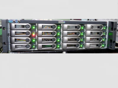 Practical hitech server disk array panel with multiple coloured winking LEDs