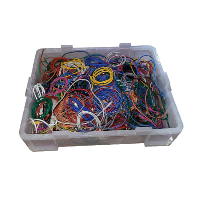 Crate of assorted coloured ethernet CAT5 computer networking cables