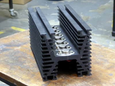 Large heavily finned heatsink/cooler assembly. Technical Sciencey shape