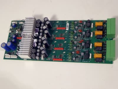 Printed Circuit Board with heat sinks/coolers, cylindrical caps, coloured components