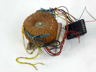 Complex looking period toroidal transformer with multiple coloured wires