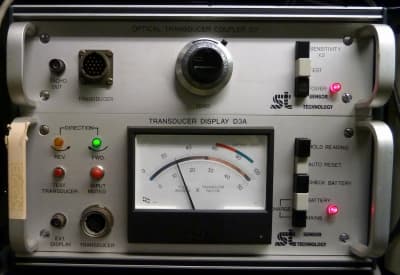 Lab instrument with remotely controlled analogue meter dial