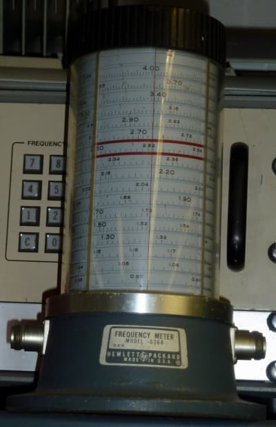 Frequency meter prop with rising spiral scale