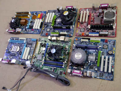 Assorted modern, colourful computer motherboards (PCBs)