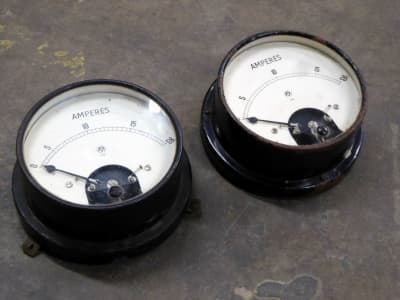 Large black period electrical meters