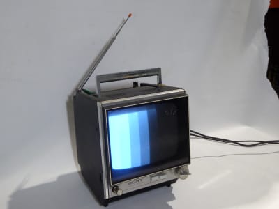 Practical 1969 Sony 9-90UB 9" black & white portable TV in black & chrome