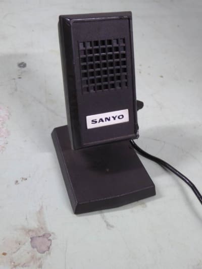 Small desk microphone with built in stand