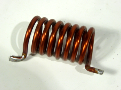 Small thickly wound copper wire coil
