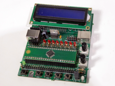 Part practical microchip development Printed Circuit Board with LEDs, buttons blue LCD display