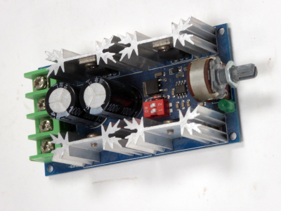 Blue motor control Printed Circuit Board with aluminium starburst heatsinks / coolers