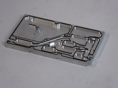 Intricately machined aluminium slab with shaped compartments
