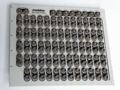 Silver Maddox patch panel with dense matrix of 138 BNC sockets