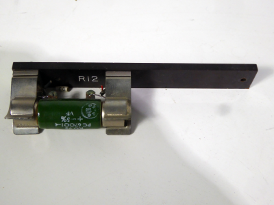 Green vitreous power resistor on baseboard strip