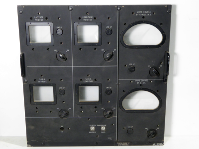 Large black military navigational control panel with crescent & rectangle windows