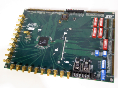 Printed Circuit Board with coloured banks of switches, multiple gold SMA connectors