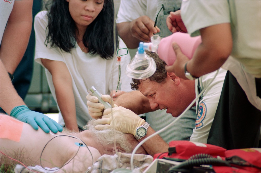 Emergency medical team assisting a patient in critical condition