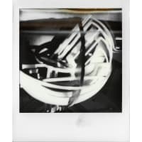 Abstract black and white image of a spherical object with intersecting lines