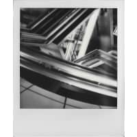 A black and white photograph of abstract geometric shapes and lines