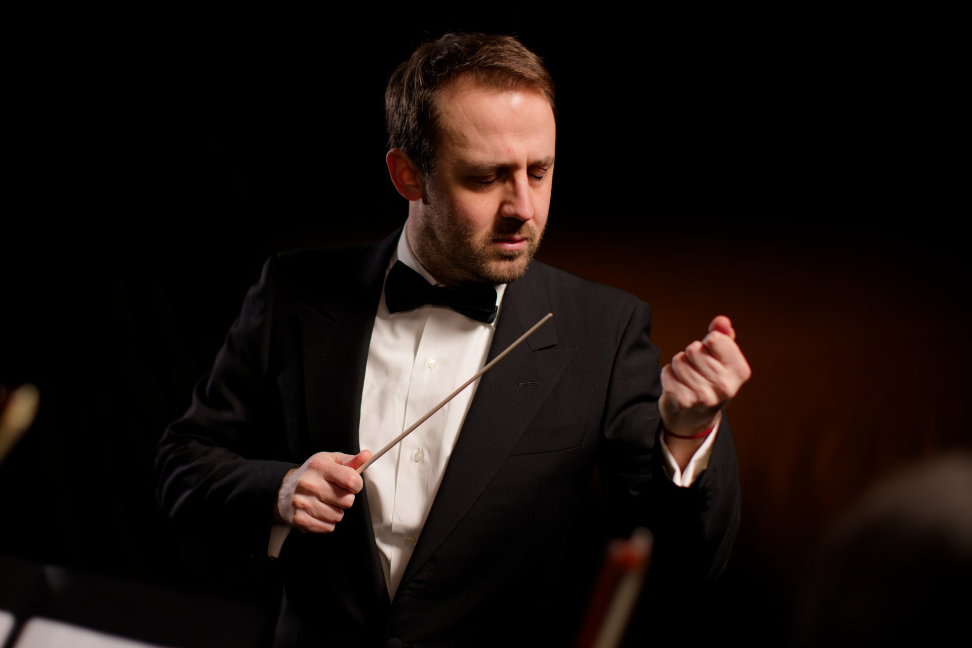 Luigi Mazzocchi, Italian conductor, leading a symphony orchestra