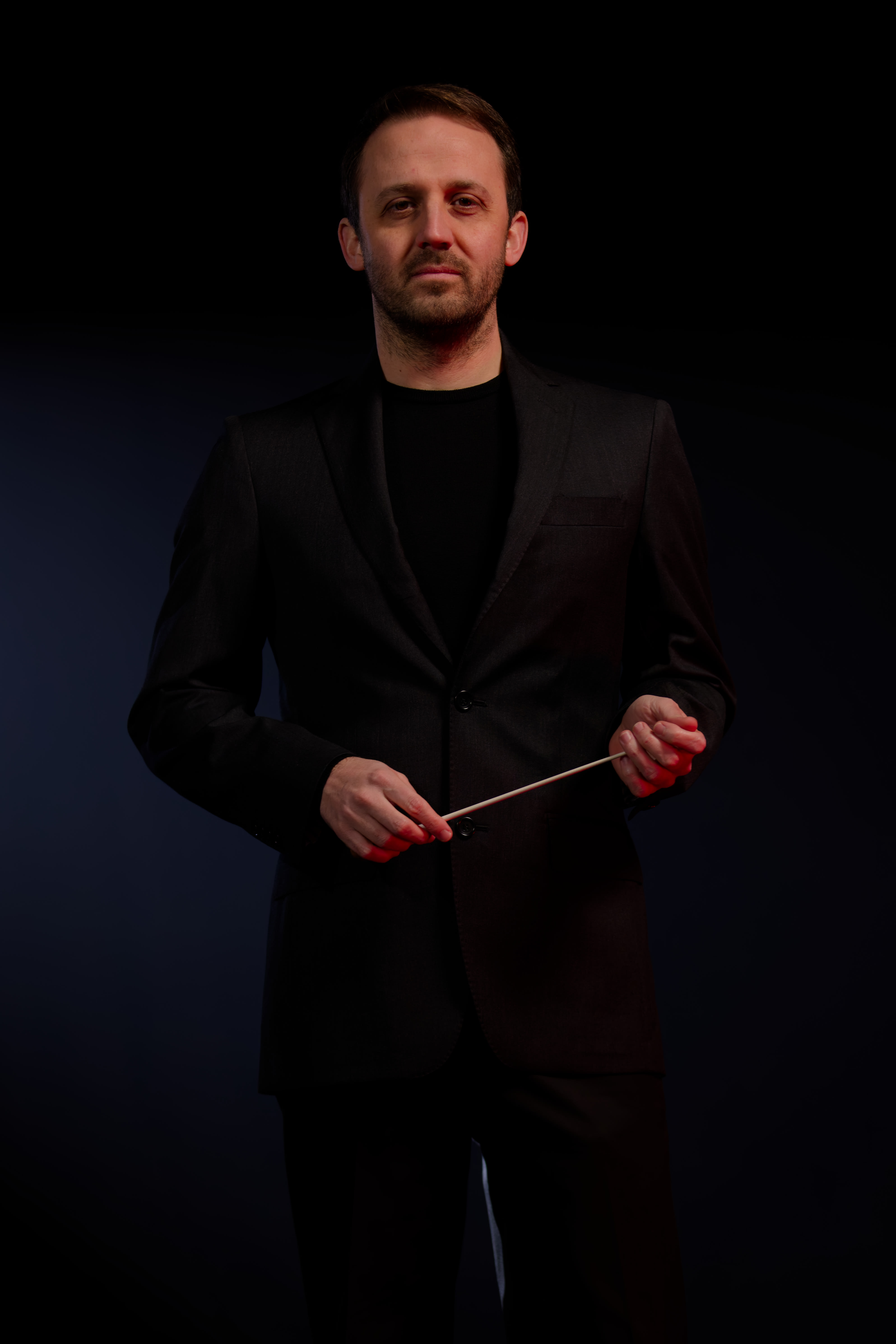 Luigi Mazzocchi on the podium during an orchestral performance