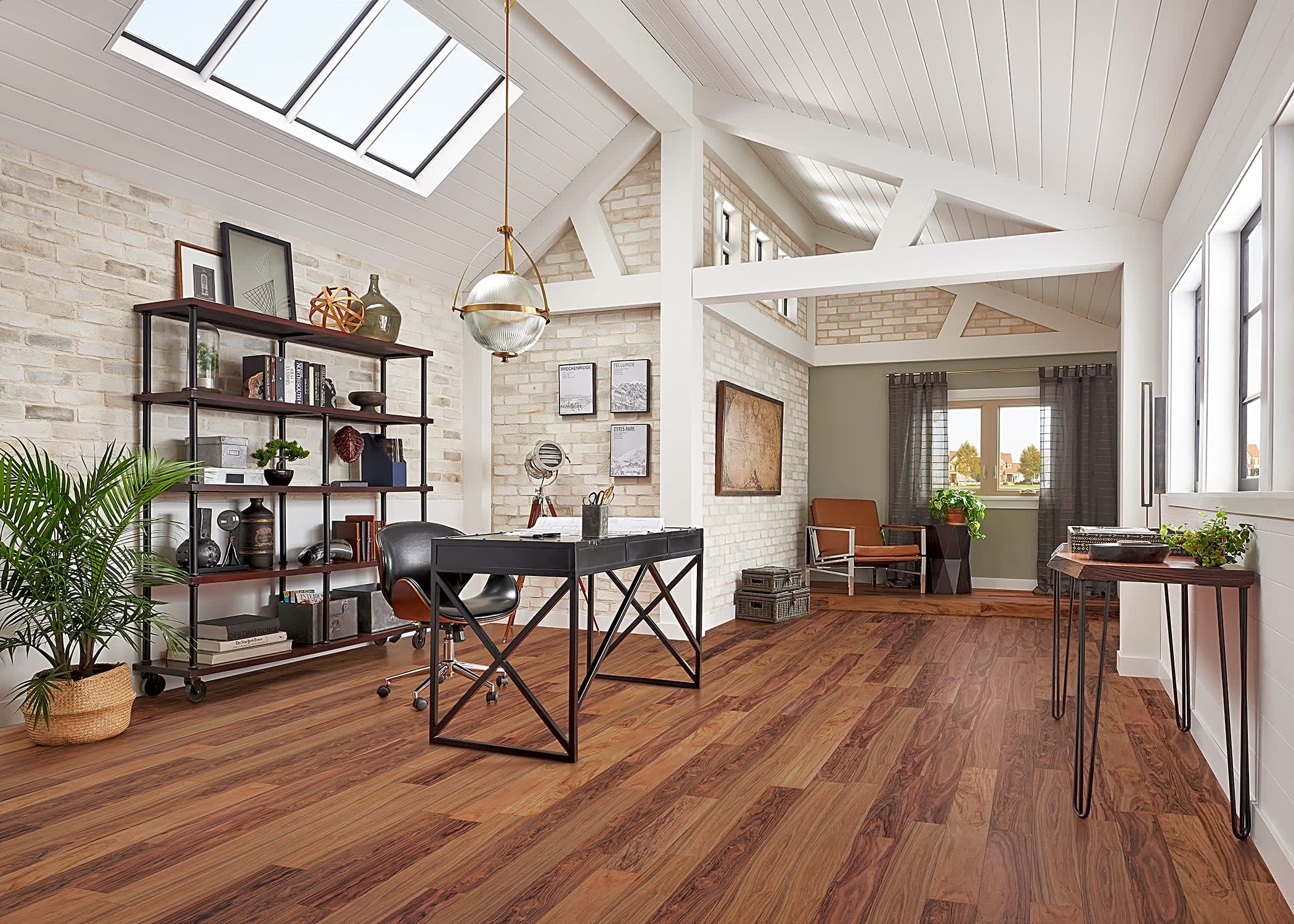 This gorgeous workspace is brought to life with house plants, and features the exotic Curupay solid hardwood flooring from Bellawood.