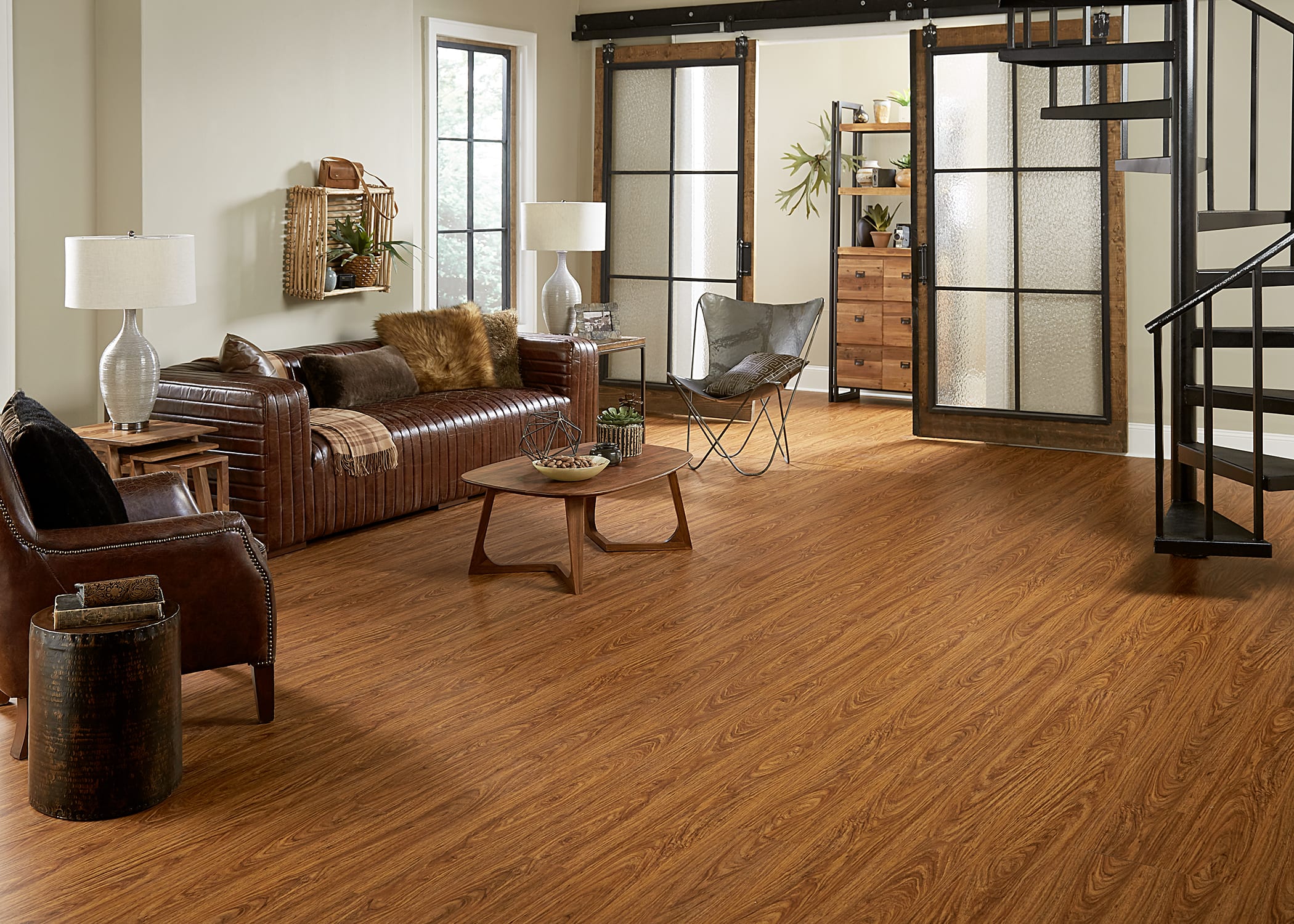 room with sofa and room dividers and vinyl plank flooring