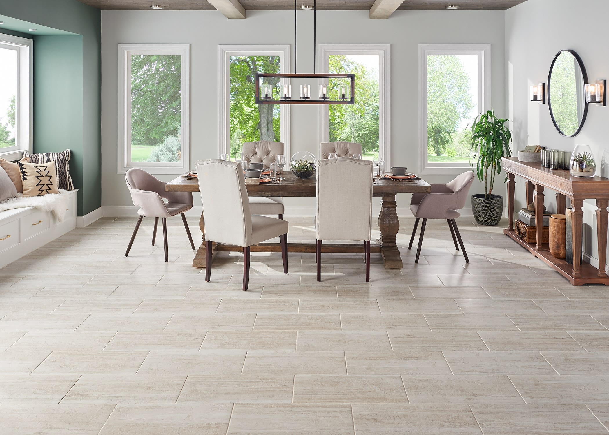 This luxurious dining room has a resort feel with bright decor featuring beautiful tile flooring from LL Flooring.