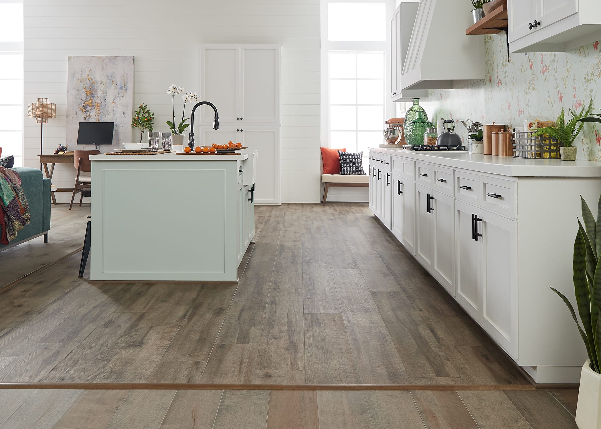 this kitchen features realistic rigid vinyl plank wood flooring