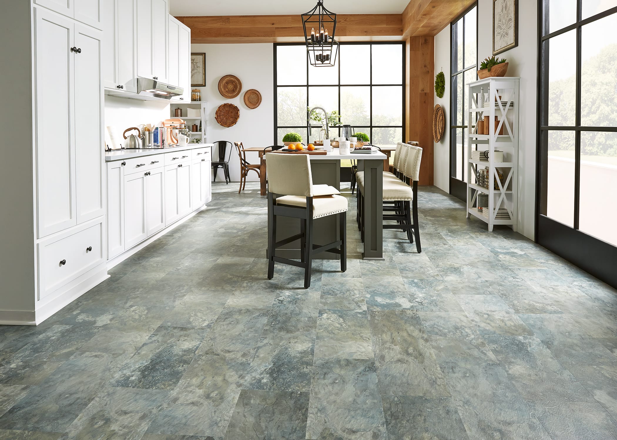 dining room with stone look rigid vinyl plank flooring