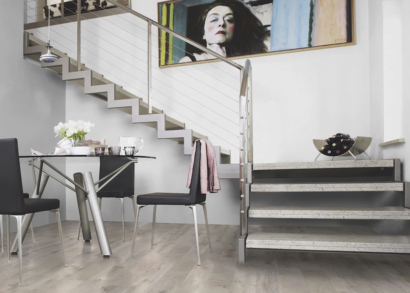 This contemporary living room features modern cable staircase and Sussex Oak Laminate Flooring from LL Flooring