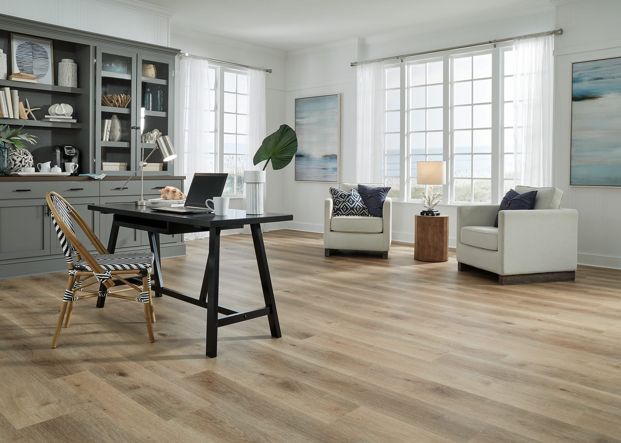 This bright sitting room and study gets great natural light and new waterproof rigid vinyl plank flooring.