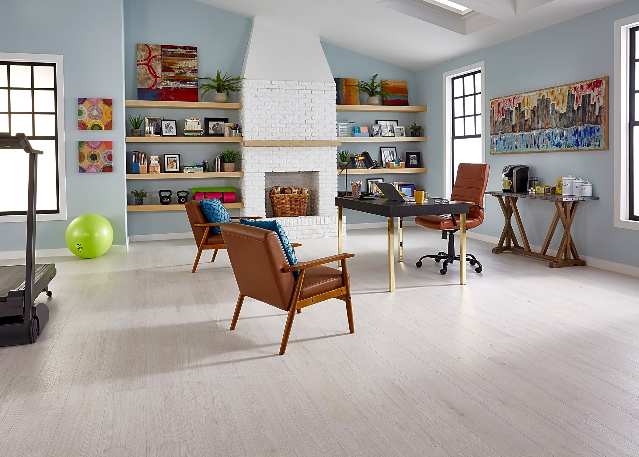 This study and fitness room makes great use of some new neutrals and pops of some brighter accents, featuring Duravana Urban Mist Oak waterproof hybrid resilient wood flooring.