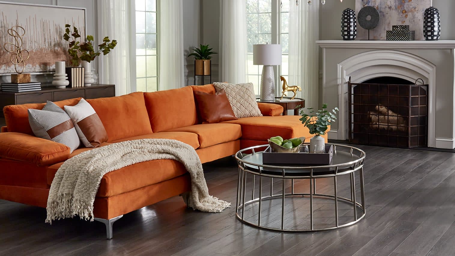 This bright couch has a mid-century color and texture, paired with industrial coffee table for a balance of styles.
