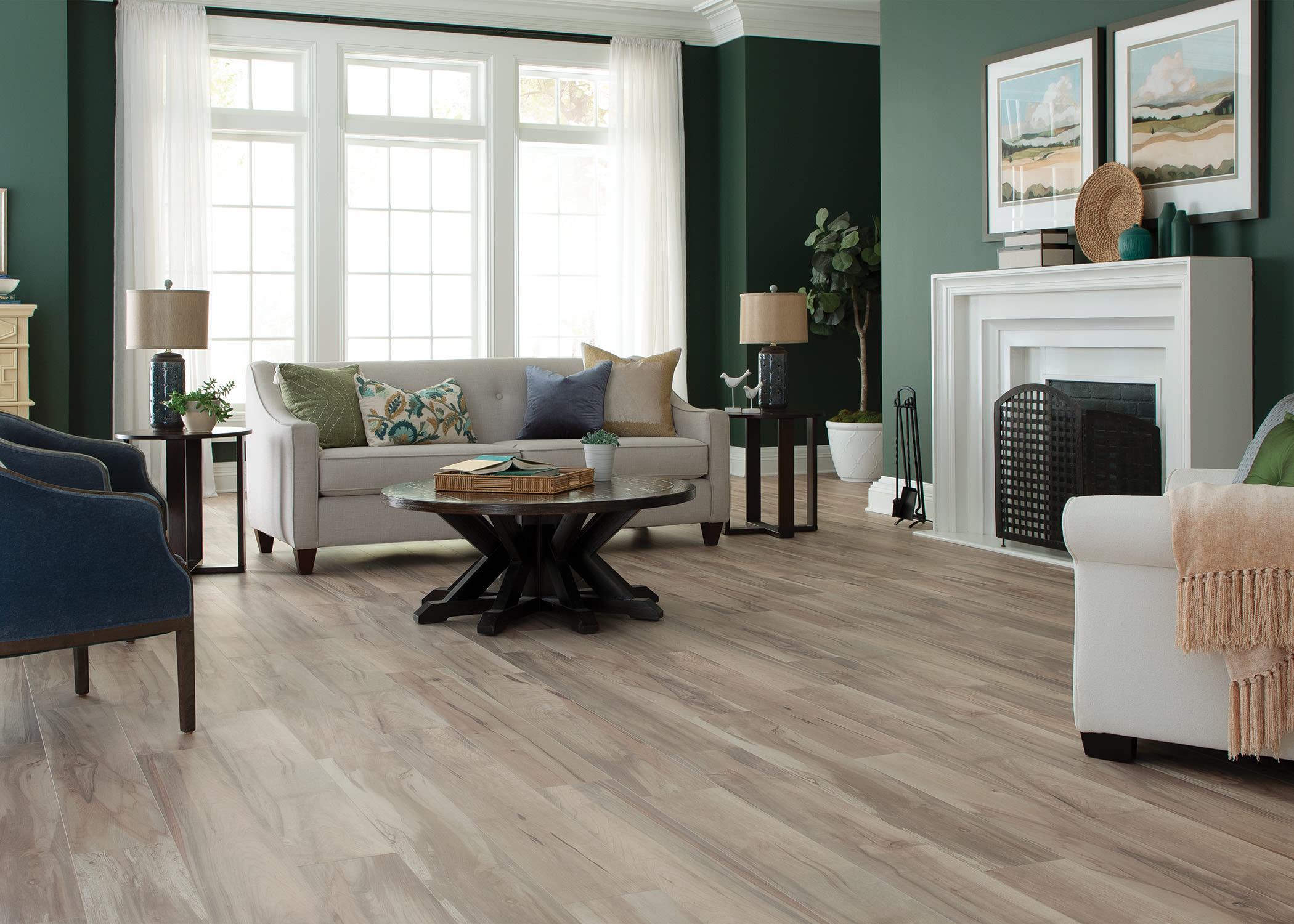 living room with sage green walls and waterproof hybrid wood flooring