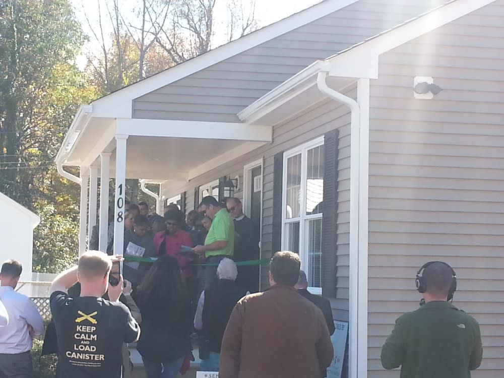 people gathered on patio at Habitat for Humanity home