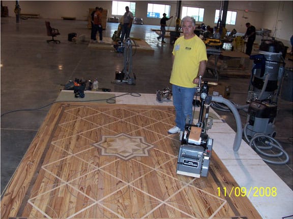 Bob standing near his floor buffer getting ready to sand