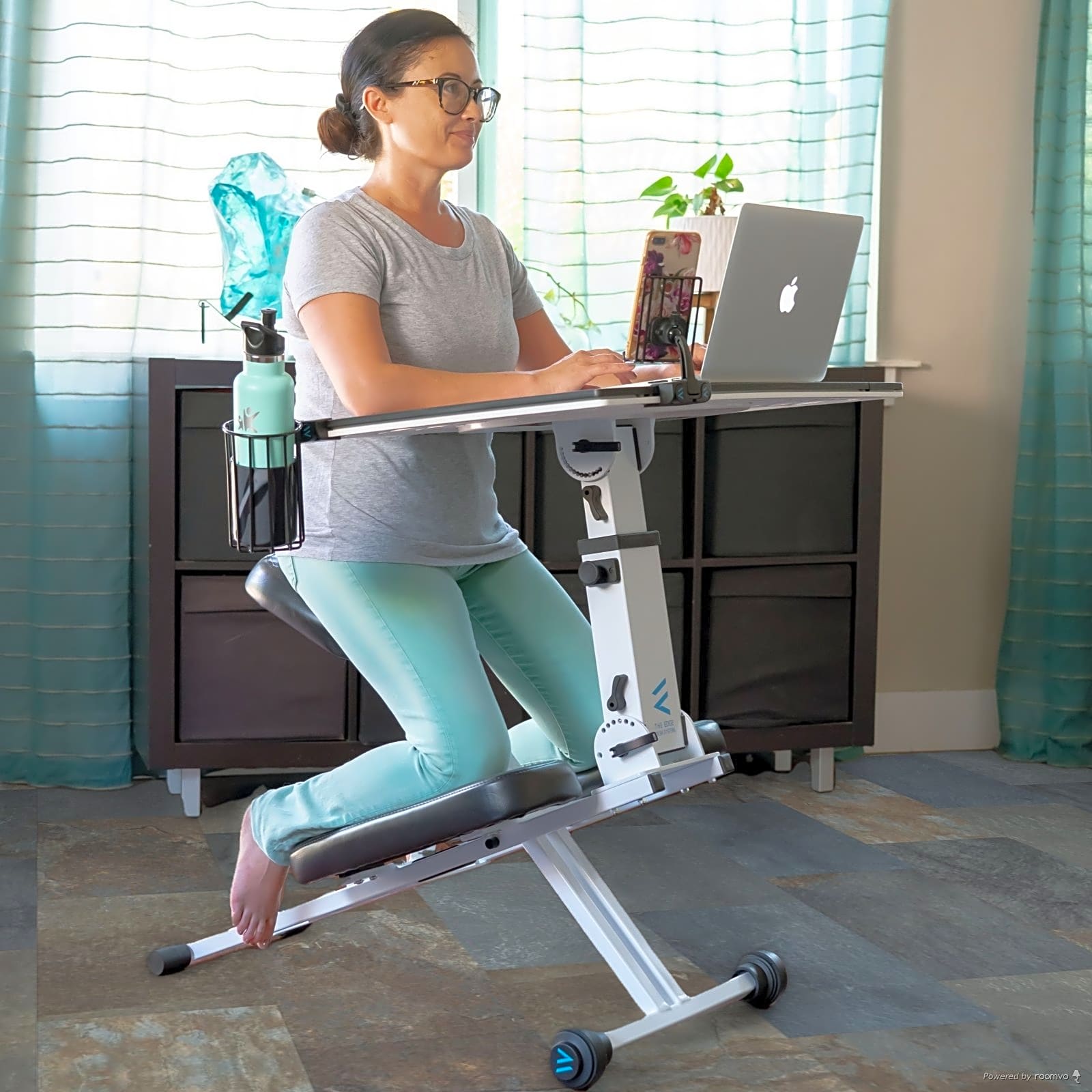 The Edge Ergonomic Desk System is ideal for space, with clear ergonomic benefits. This workspace features Dewey Meadow Oak Rigid Vinyl Plank