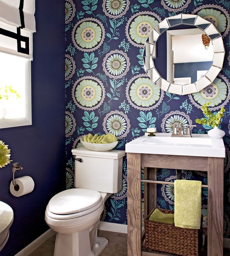 Bathroom with dark blue floral patterned wall.