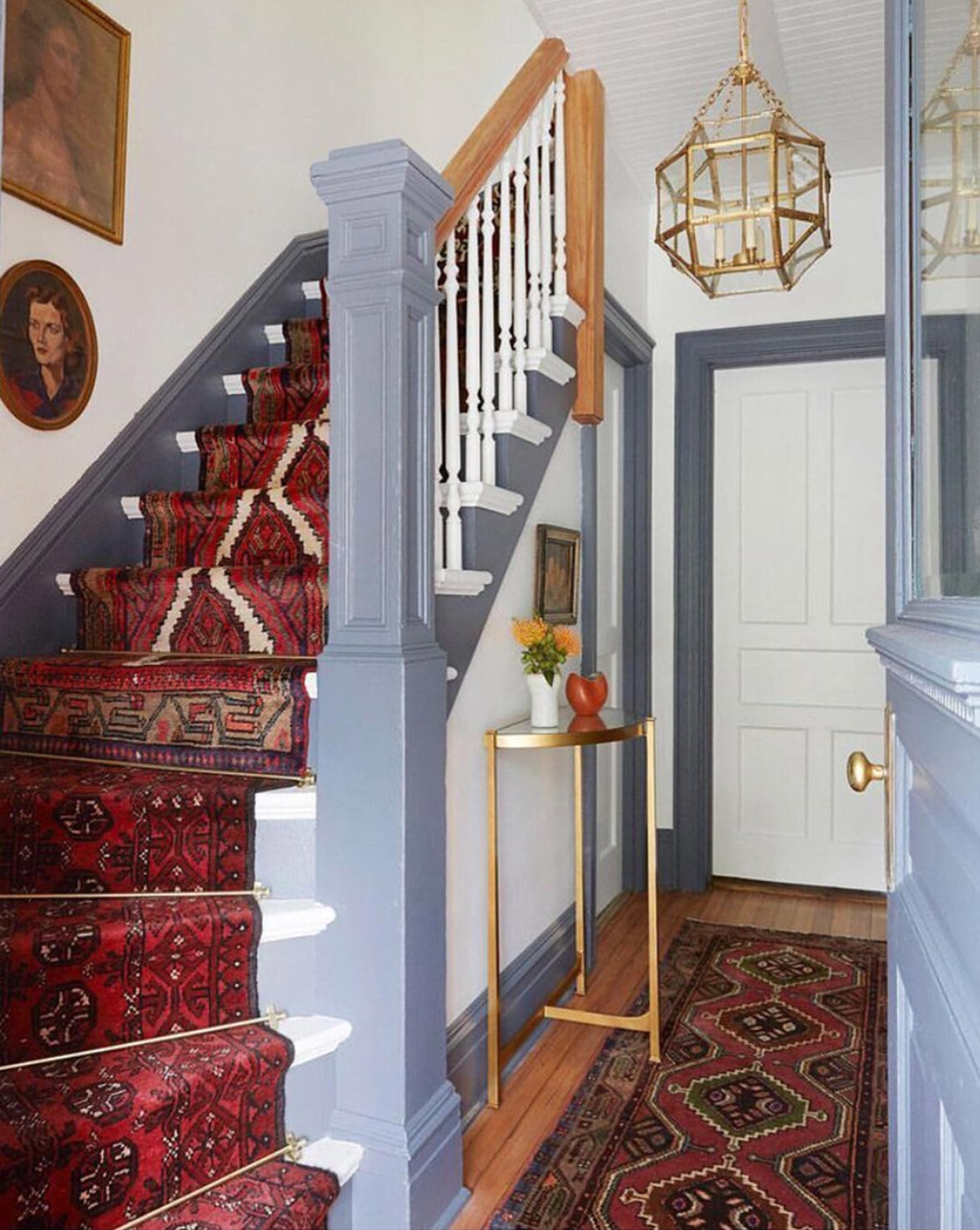 This staircase has a red vintage rug modified as a runner to add color and interest