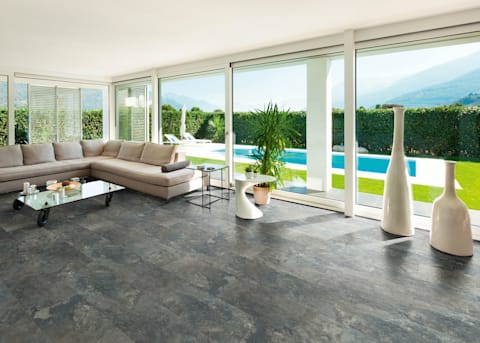 Gorgeous pool shows through the windows and flooring by CoreLuxe XD Sierra Blue Slate Rigid Vinyl Plank Flooring provides a feel of a lively plaza.