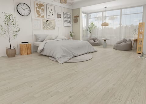6mm with Pad Rosemont Oak Waterproof Vinyl Plank Flooring in bedroom with light gray bedding and gray bean bag chairs with small side table